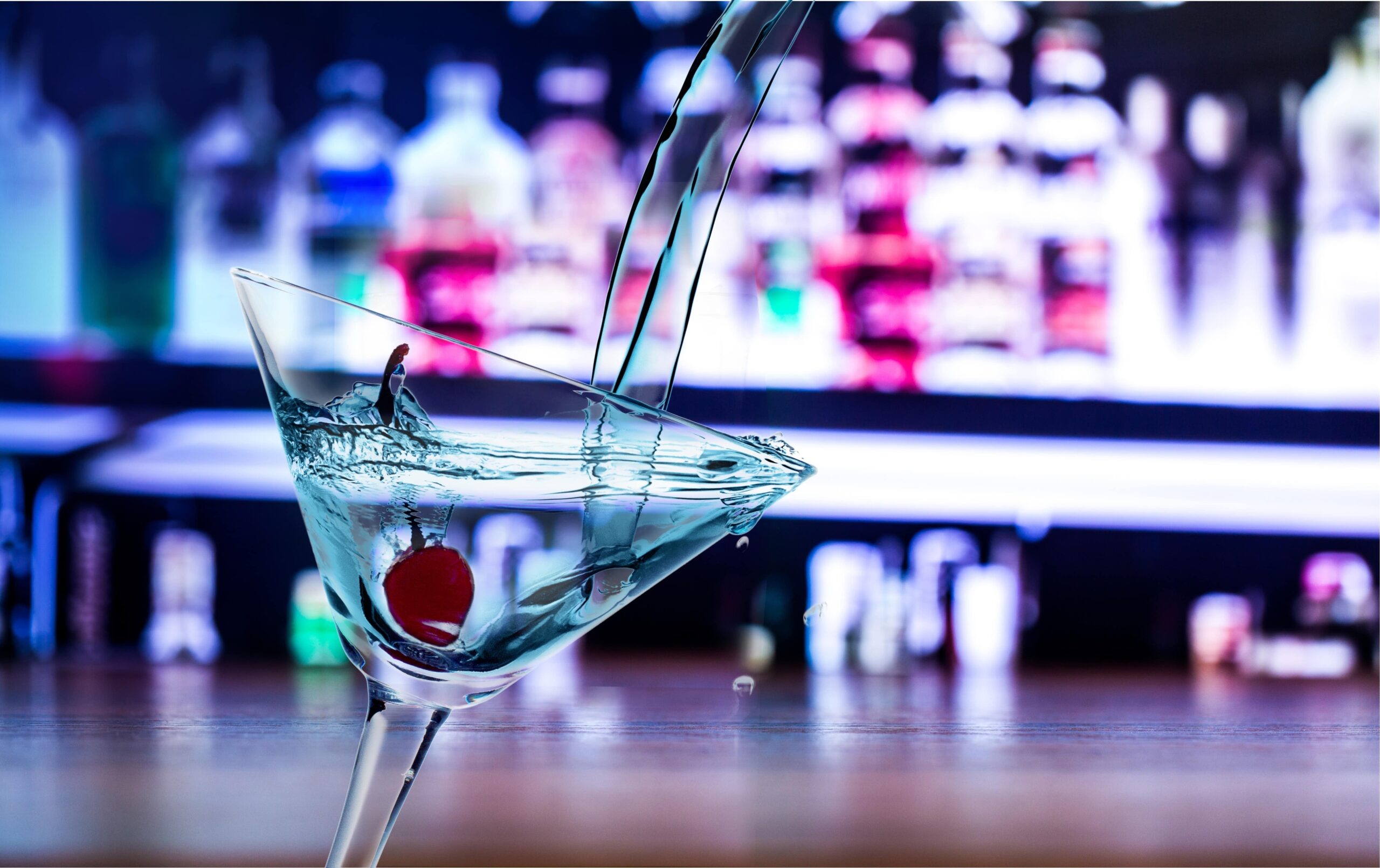 A close-up of a martini being prepared in a glass at Bars in Larnaca.