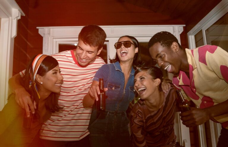 Group of friends enjoying beer, laughter, and fun at bars in Larnaca.