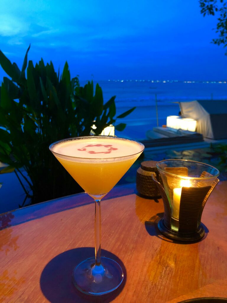 Cocktail on a table at a rooftop bar with sea view in Cyprus