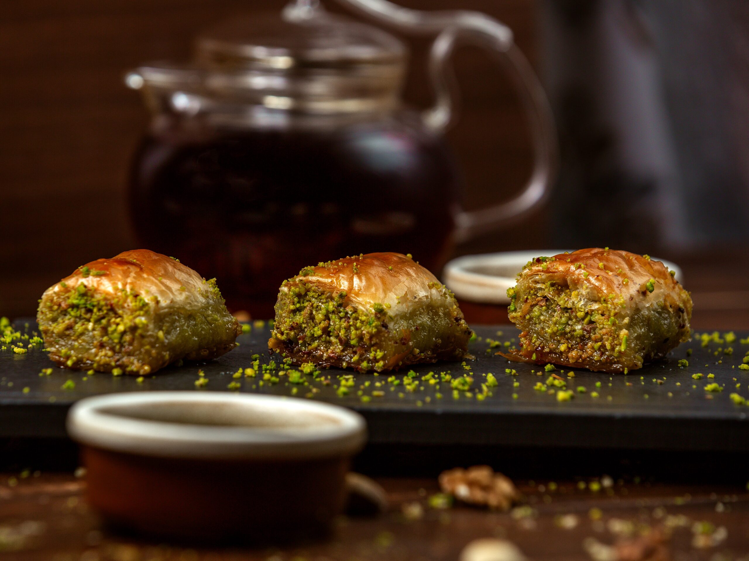 Pistachio baklava served with tea, a popular Cypriot dessert