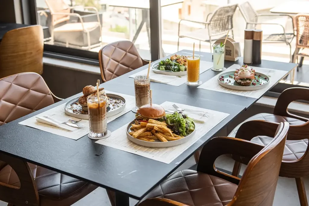 Rooftop brunch table with gourmet dishes and refreshing drinks at Memories Rooftop Larnaca